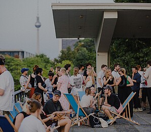 Visitors at Forward Festival Berlin with TV-Tower in the Background