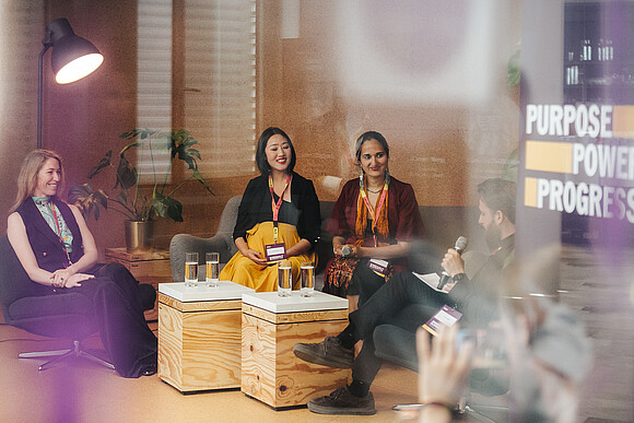 three people sittung together in a panel